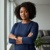 Bakers Bands Limited bright guava nylon sport loop watch band worn by a woman in a navy long-sleeve shirt