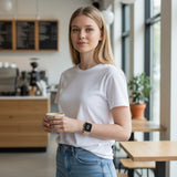 Bakers Bands Limited cantaloupe nylon woven sport loop on a woman wearing a white t-shirt in a cafe