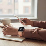 Bakers Bands Limited cantaloupe nylon woven sport loop band on a person's wrist while working at a desk.
